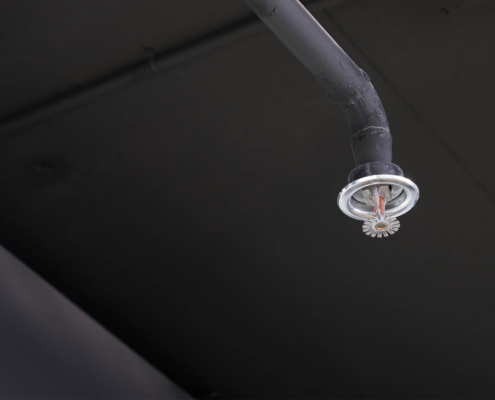 Fire Sprinklers Put On The Black Ceiling Of Modern Office